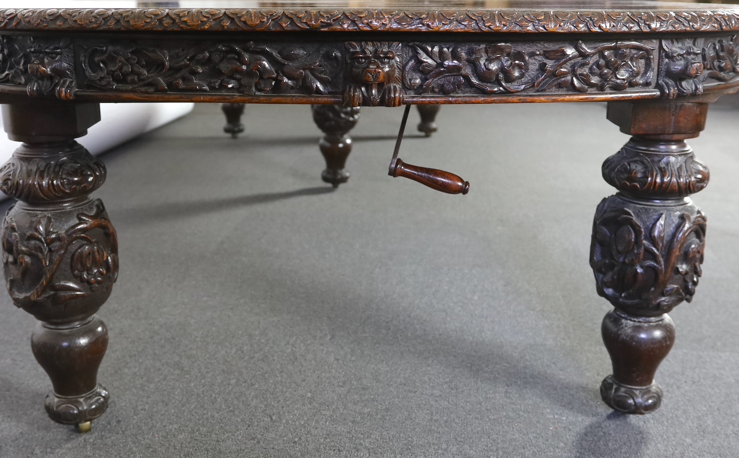 A late Victorian carved oak extending dining table, 178 x 142cm, extends to 356cm H.75cm